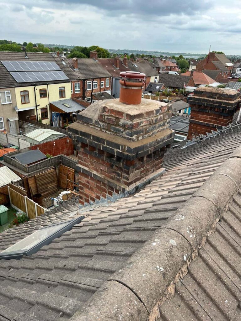 This is a photo taken from a roof which is being repaired by Arundel Roofing Repairs, it shows a street of houses, and their roofs